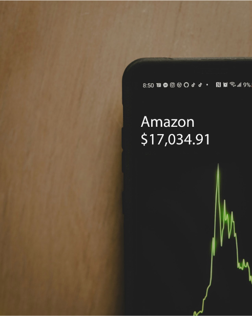 Photo of a phone showing Amazon stock value at $17,034.91