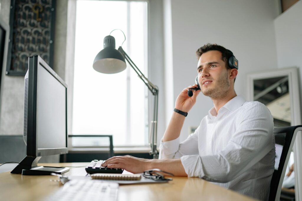 Male support agent in a white dress shirt